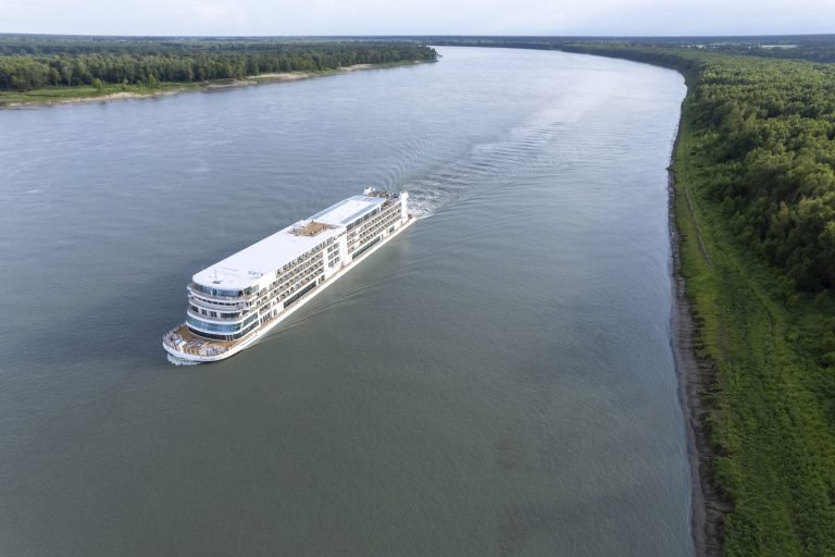 Aerial view of a Viking river ship sailing the Mississippi River